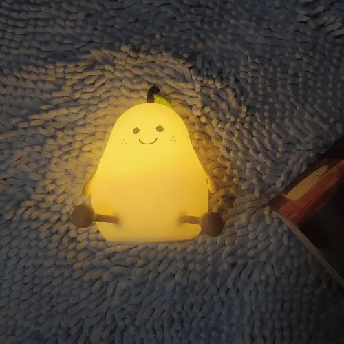 Photo avis client positif sur la veilleuse poire en silicone pour bébé, lampe rassurante et douce la nuit